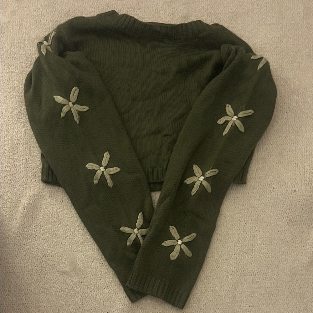 dark green cropped sweater with sewn-in flowers on sleeves!